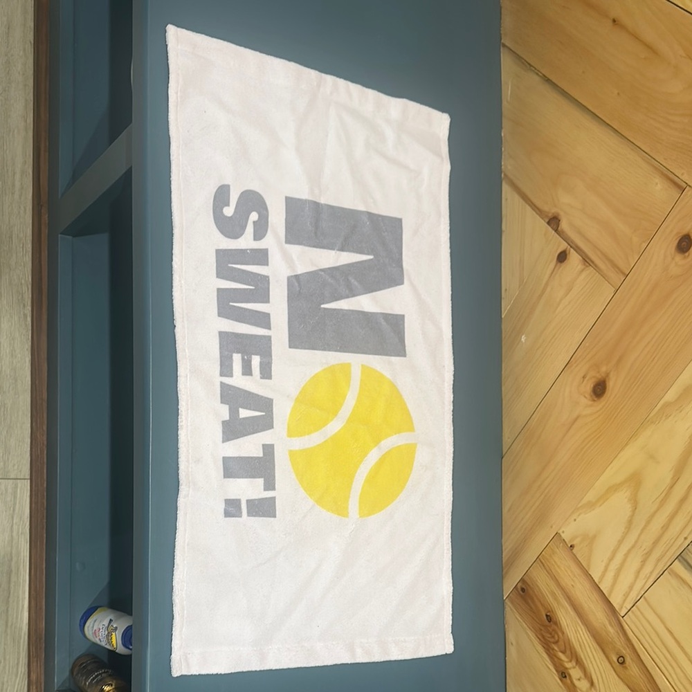 White Hand Towel with Gray and Yellow Tennis Ball Print That Reads No Sweat